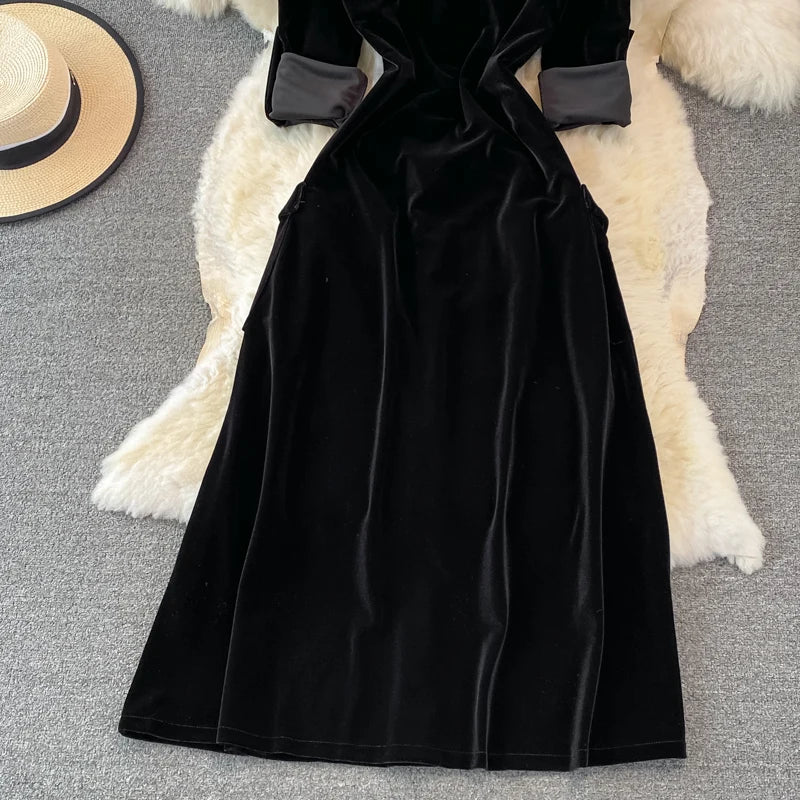Robe vintage en velours noir à simple boutonnage et poches pour femme