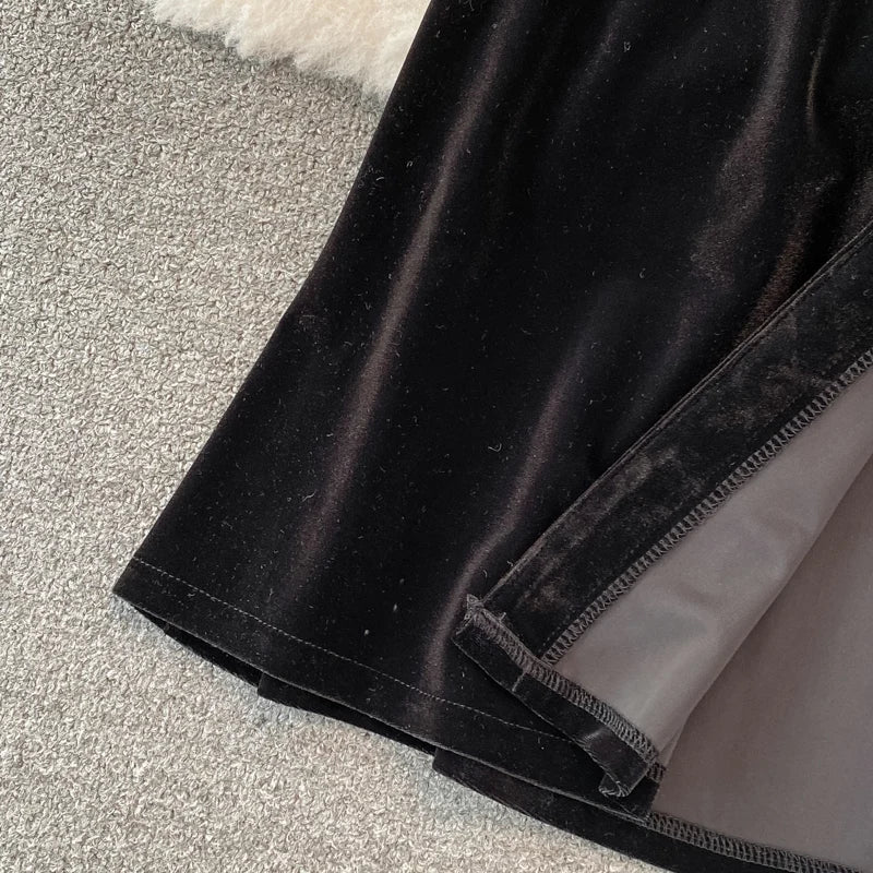 Robe vintage en velours noir à simple boutonnage et poches pour femme